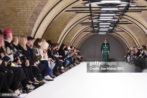 Model walks the runway at the Craig Green show during London Fashion Week Men's January 2019 on January 07, 2019 in London, England.