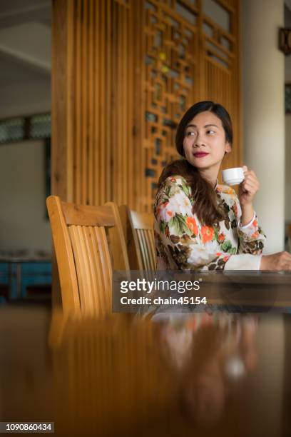 vietnamese woman drink coffee in the morning. old tradition vietnam style. - hot vietnamese women stock pictures, royalty-free photos & images