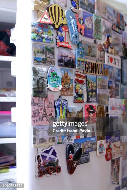 fridge door with colored magnets - souvenir collection stock pictures, royalty-free photos & images