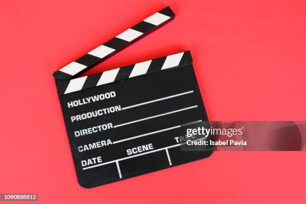 filmmaker's clapboard on red background. - weatherboard stock pictures, royalty-free photos & images