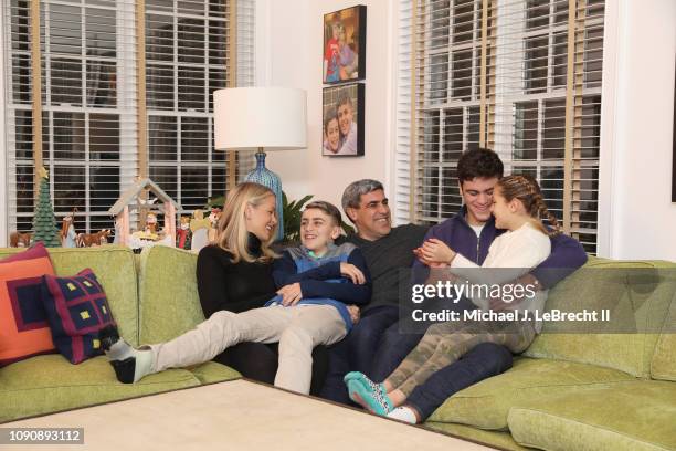 Casual portrait of New York City FC director of football operations Claudio Reyna and his wife, Danielle Egan Reyna, posing with their children...