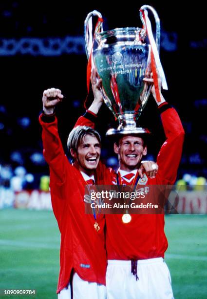 David Beckham and Teddy Sheringham of Manchester United celebrate the victory with the trophy during the UEFA Champions league final match between...