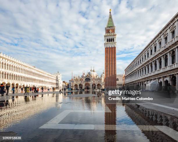 acqua alta at st mark square, venice, italy - saint mark stock pictures, royalty-free photos & images