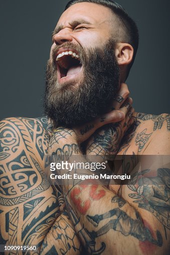 Portrait Of Young Man With Beard Covered In Tattoos Hands Around Throat  Screaming High-Res Stock Photo - Getty Images