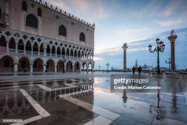 st mark's square flooded by high tide, venice, italy - st mark's square stock pictures, royalty-free photos & images