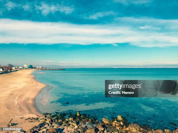 view of beach and clouds in pomorie, bulgaria. - burgas stock pictures, royalty-free photos & images