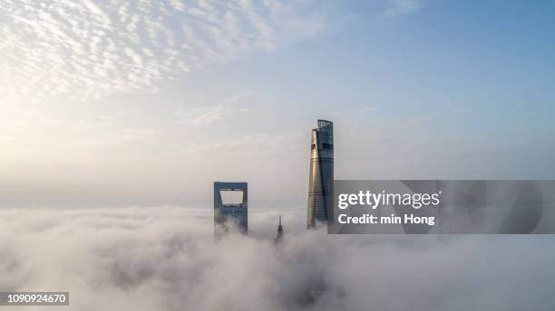 aerial view of shanghai lujiazui financial district in fog - skyscraper cloud stock pictures, royalty-free photos & images