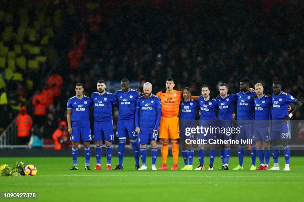 The Cardiff City team take part in a minute of silence in tribute to Emiliano Sala prior to the Premier League match between Arsenal and Cardiff City...
