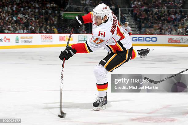 Rene Bourque of the Calgary Flames fires a shot on goal against the Colorado Avalanche at the Pepsi Center on February 14, 2011 in Denver, Colorado.