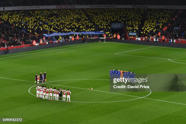 Arsenal FC and Cardiff City FC teams take part in a moment of reflection for Emiliano Sala before the Premier League match between Arsenal FC and...