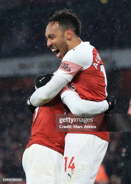 Pierre-Emerick Aubameyang of Arsenal celebrates scoring from the penalty spot during the Premier League match between Arsenal FC and Cardiff City at...