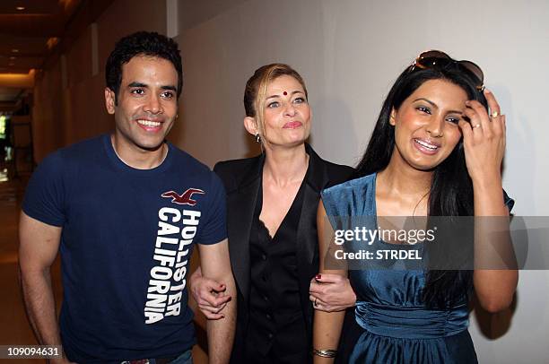 Indian Bollywood actor Tushar Kapoor and actress Geeta Basra pose with French singer Anabelle Varma at a release party for her 'romantic music' hindi...