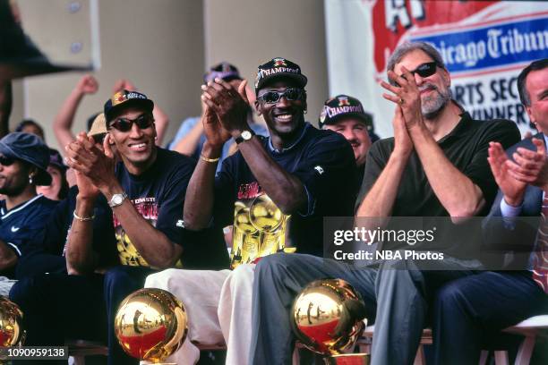 Scottie Pippen, Michael Jordan, and Head Coach Phil Jackson of Chicago Bulls are smiling at the Chicago Bulls Championship Parade and Rally on June...