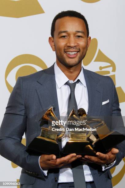 Musician John Legend poses in the press room with the award for Best R&B Album for 'Wake Up!', Best R&B Song for 'Shine' and Best Traditional R&B...