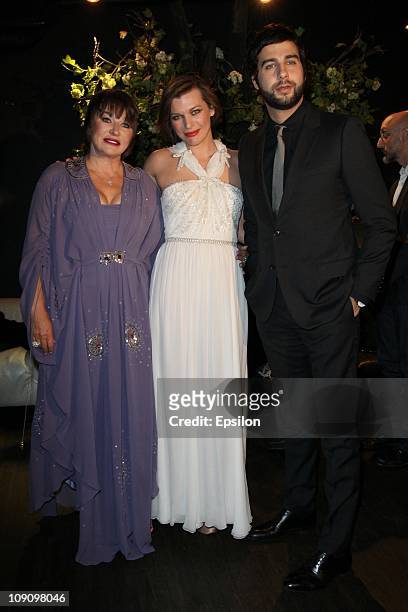 Actress Mila Jovovich with her mother Galina Loginova and actor Ivan Urgant attend premiere of "Vykrutasi" film in "Oktyabr" cinema hall in Moscow on...