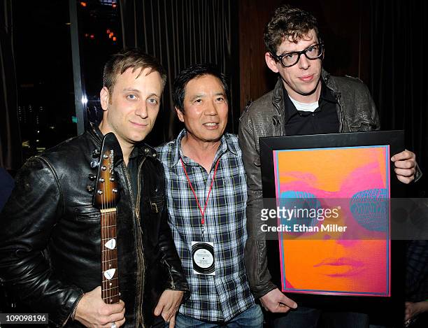 Adriano Goldschmied owner Yul Ku and recording artists Dan Auerbach and Patrick Carney of The Black Keys attend the launch of AG Adriano...