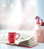 Valentine's day background,red mug on window still.