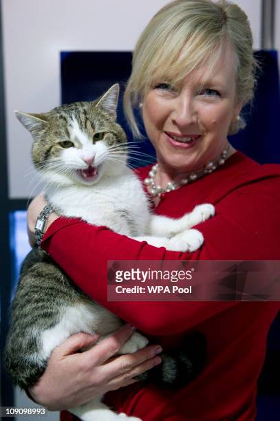 Claire Horton, CEO of Battersea Dogs and Cats Home in London, holds the new Downing Street cat 'Larry' before he is taken to the Prime Ministers...