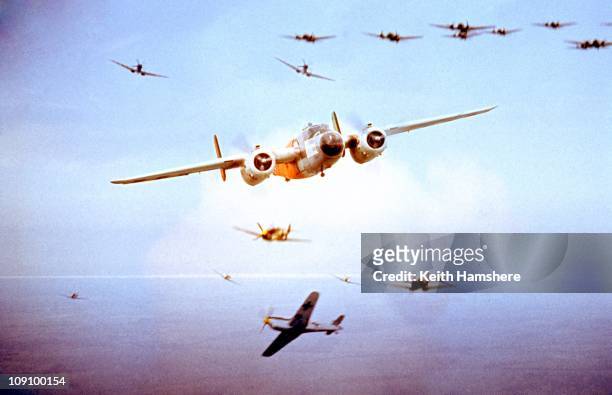 An optical merged image of the camera plane, a North American B-25 Mitchell and a dogfight over the UK, during the filming of 'Battle Of Britain',...