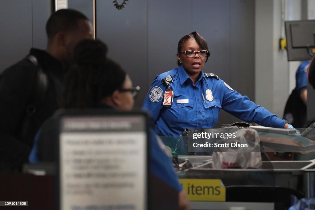 TSA Agents Work At Airport Security As Government Shutdown Continues