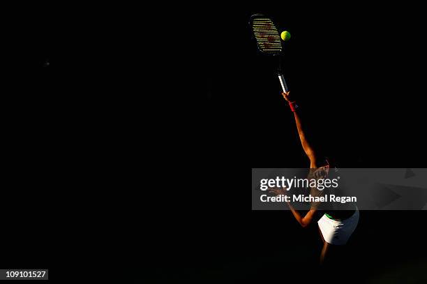 Ayumi Morita of Japan serves during her Round 1 match against Petra Kvitova of the Czech Republic during day two of the WTA Dubai Duty Free Tennis...