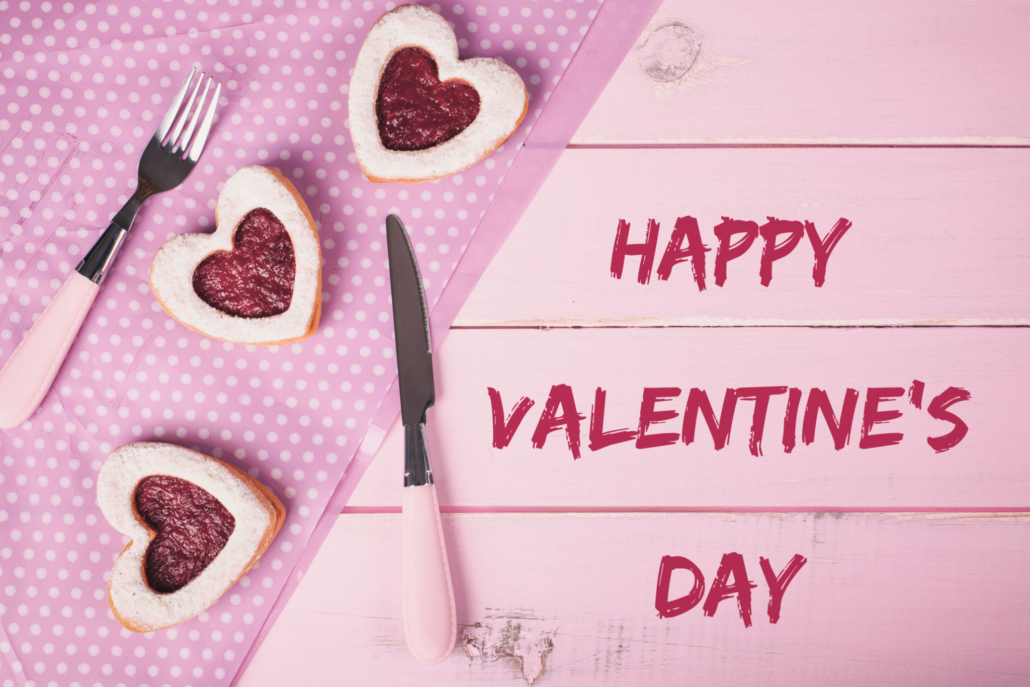 Love heart valentine cookies on pink rustic wooden table. Love heart valentine cookies on pink rustic wooden table.