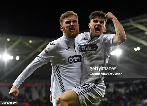 Oli McBurnie of Swansea City celebrates scoring his sides third goal with Daniel James of Swansea City during the Sky Bet Championship match between...