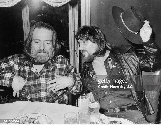 Musicians Willie Nelson, left, and Waylon Jennings, right, at a party at the Rainbow Room in Manhattan on January 16, 1978.
