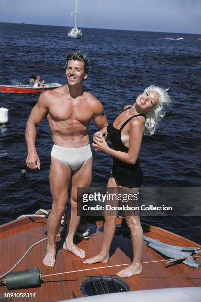 Actress Jayne Mansfield poses for a photo with husband Mickey Hargitay on their way to Catalina on July 22, 1957 between Los Angeles and Catalina,...