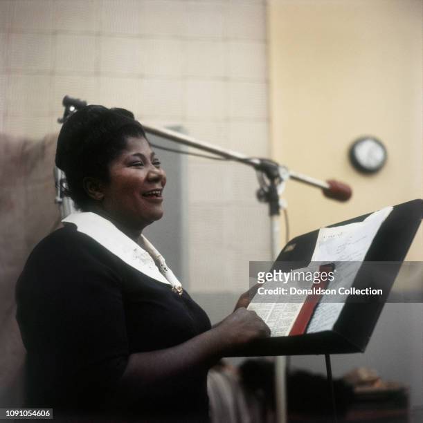 Singer Mahalia Jackson in the Columbia Records studio recording the Duke Ellington album 'Black, Brown and Beige' in February 1958 in Los Angeles,...