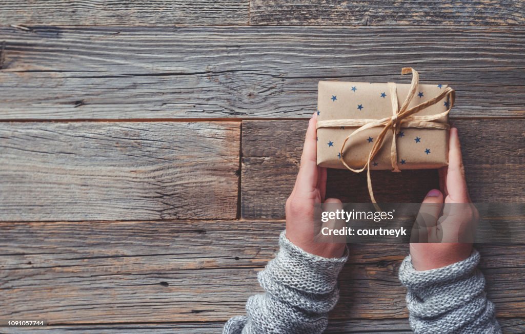 Rustic gift box on a wooden table.