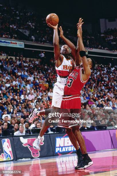 Henry James of the Atlanta Hawks shoots the ball against the Chicago Bulls on May 10, 1997 during Game Two of the NBA Eastern Conference Semifinals...