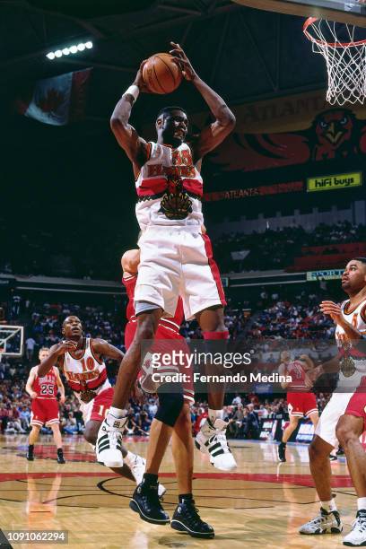 Dikembe Mutombo of the Atlanta Hawks handles the ball against the Chicago Bulls on May 10, 1997 during Game Two of the NBA Eastern Conference...