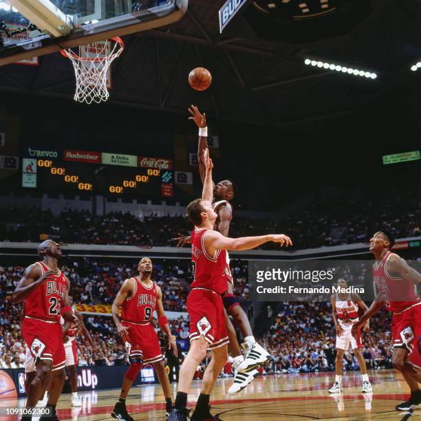 Dikembe Mutombo of the Atlanta Hawks shoots the ball against the Chicago Bulls on May 10, 1997 during Game Two of the NBA Eastern Conference...