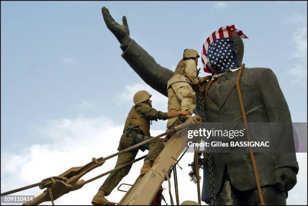 Operation Iraqi Freedom Us Troops Enter Central Baghdad And Topple Statue Of Saddam Hussein On April 9, 2003 In Baghdad, Iraq. Members Of The Us...