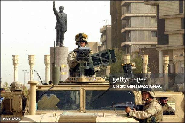 Operation Iraqi Freedom Us Troops Enter Central Baghdad And Topple Statue Of Saddam Hussein On April 9, 2003 In Baghdad, Iraq. Members Of The Us...