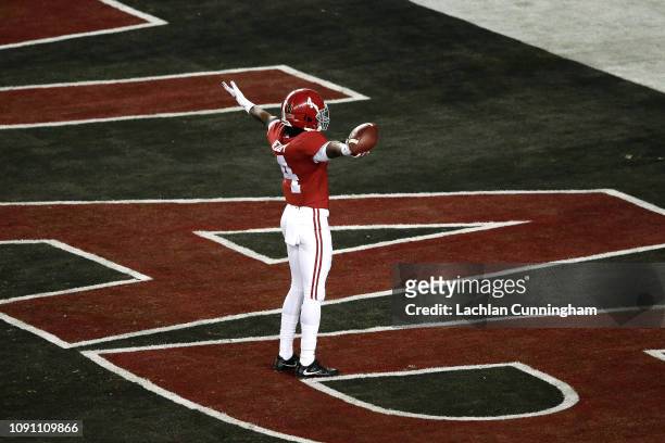 Jerry Jeudy of the Alabama Crimson Tide celebrates his 62 yard touchdown reception thrown by Tua Tagovailoa against the Clemson Tigers during the...