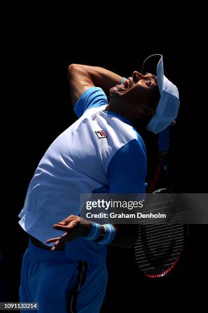 Carlos Berlocq of Argentina serves in his match against Dustin Brown of Germany during day one of Qualifying for the 2019 Australian Open at...