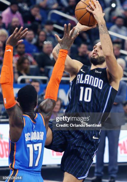Orlando Magic guard Evan Fournier shoots past Oklahoma City Thunder guard Dennis Schroder on Tuesday, January 29, 2019 at the Amway Center in...