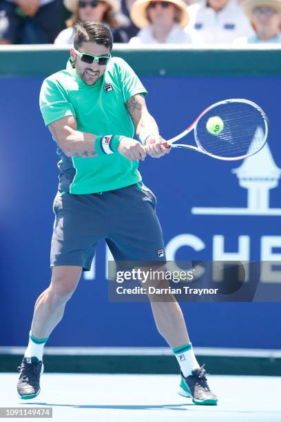 Janko Tipsarevic of Serbia plays a backhand in his match against Jason Kubler of Australia during day one of the 2019 Kooyong Classic at Kooyong Lawn...