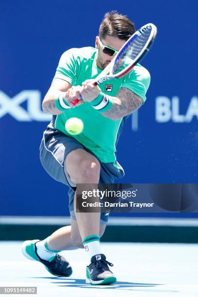 Janko Tipsarevic of Serbia plays a backhand in his match against Jason Kubler of Australia during day one of the 2019 Kooyong Classic at Kooyong Lawn...