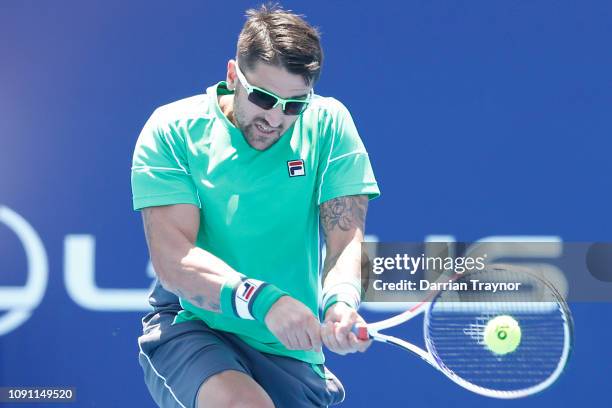 Janko Tipsarevic of Serbia plays a backhand in his match against Jason Kubler of Australia during day one of the 2019 Kooyong Classic at Kooyong Lawn...