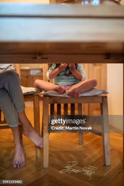 messy mealtimes, child drop food under the table. - czech republic food stock pictures, royalty-free photos & images