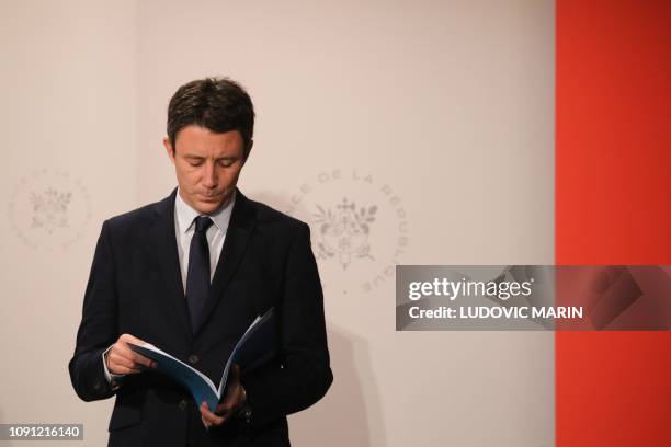 French Government's spokesperson Benjamin Griveaux reads in a document during a press conference following the weekly cabinet meeting at the Elysee...