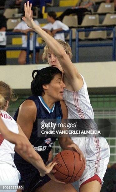 Argentine Carolina Sanchez fights for the ball with Canadian Michele Hendry 14 September 2001 in Sao Luis do Maranhao, Brazil. La argentina Carolina...
