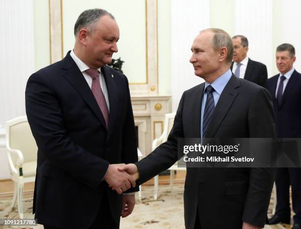 Russian President Vladimir Putin greets Moldovan President Igor Dodon during their meeting at the Kremlin on January 30, 2019 in Moscow, Russia.