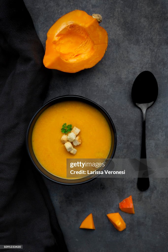 Pumpkin soup with croutons and parsley
