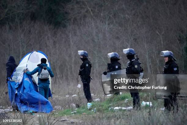French police clear a migrant camp near Calais Port on January 08, 2019 in Calais, France. In recent weeks there has been an increase in migrants,...