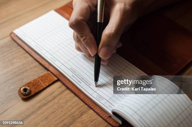 Checkbook Writing Task Checkbook Writing A Check Photos and Premium High Res Pictures - Getty ...