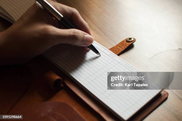 Man Write Check Man Writing A Check Photos and Premium High Res Pictures - Getty Images
